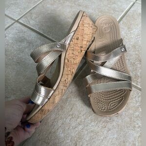 Crocs A-Leigh Mini Wedge Leather sandal with a cork sole and gold straps size 9